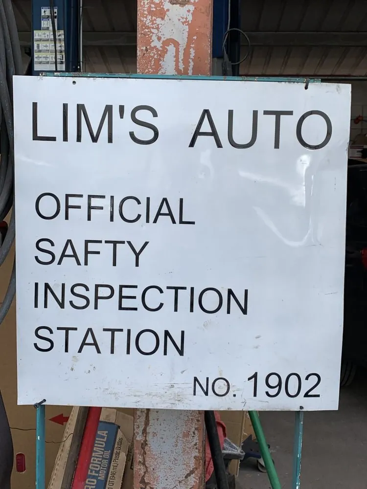 Official Safety Inspection Station sign at Lim's Auto Service
